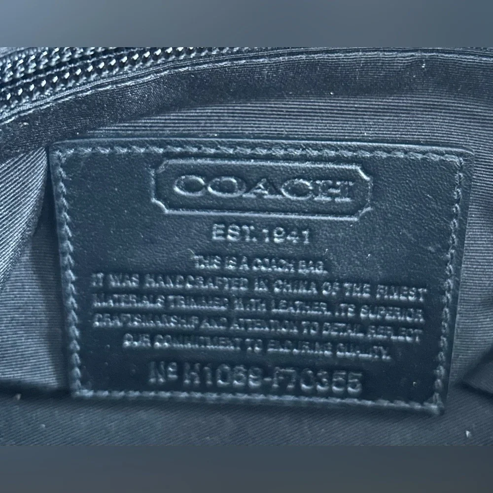 Unisex Coach crossbody messenger bag.